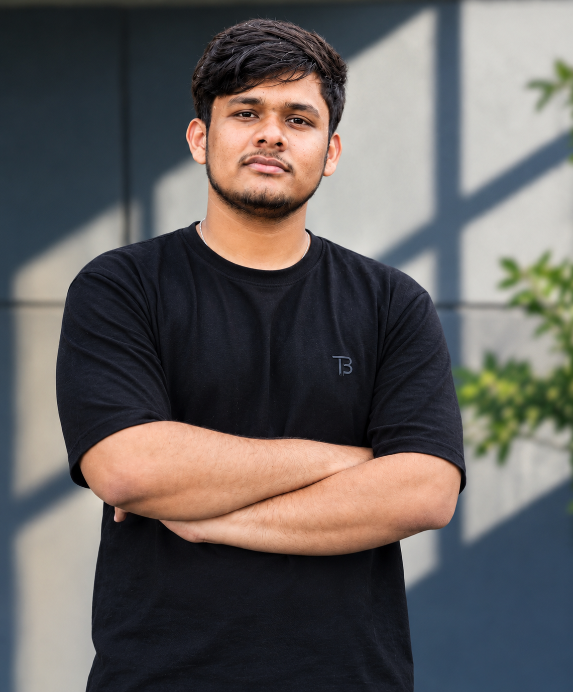 Dhruv Mishra standing with arms crossed